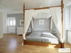 Bestlage Kaiserebersdorf! Möblierte 2-Zimmer-Wohnung für Singles oder Pärchen mit Balkon, Gartennutzung und Schwimmbiotop - Bild