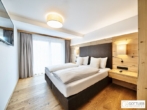 Bestlage Pinzgau mit ca. 6% Rendite! Sonniges 4-Zimmer-Apartment mit zwei Terrassen sowie Aussenpool - Bild