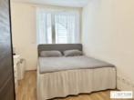 Bild - Nähe Schloss Neugebäude! Bis November 2026 befristet vermietete sonnige 2-Zimmer-Wohnung mit Loggia und Tiefgaragenplatz in Grünruhelage