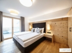 Bestlage Pinzgau mit ca. 6% Rendite! 3-Zimmer-Wohnung mit Südterrasse sowie beheiztem Aussenpool - Bild
