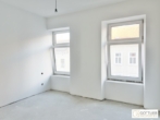 Erstbezug in U-Bahn-Nähe! Liebevoll generalsanierte 2-Zimmer-Altbau-Wohnung mit Loggia und Grünblick in Gründerzeithaus - Bild