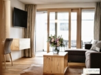 Bestlage Pinzgau mit ca. 6% Rendite! Sonniges 4-Zimmer-Apartment mit zwei Terrassen sowie Aussenpool - Bild